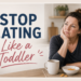 Middle-aged woman sitting at a kitchen table with a mug and a small bowl of Goldfish crackers, looking thoughtfully into the distance. Large text reads “Stop Eating Like a Toddler.” The image represents a midlife mindset shift around food choices, discipline, and healthy habits.