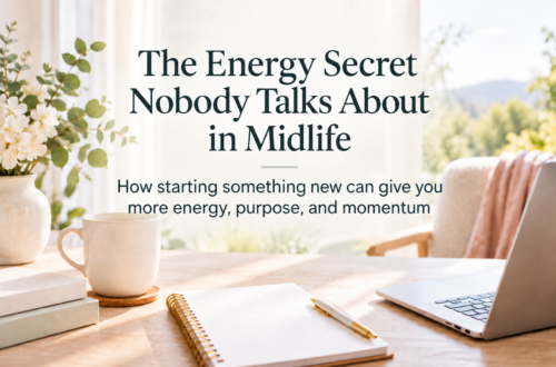 Bright, feminine workspace with a laptop, notebook, coffee mug, and flowers, featuring the title “The Energy Secret Nobody Talks About in Midlife” and a subtitle about finding more energy through starting something new.